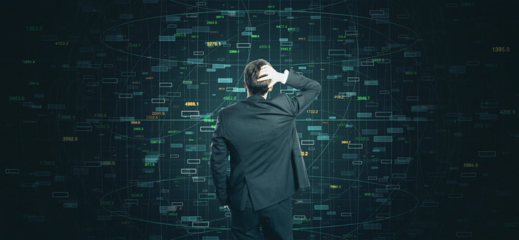 A man facing a wall of data, illustrating information overload.