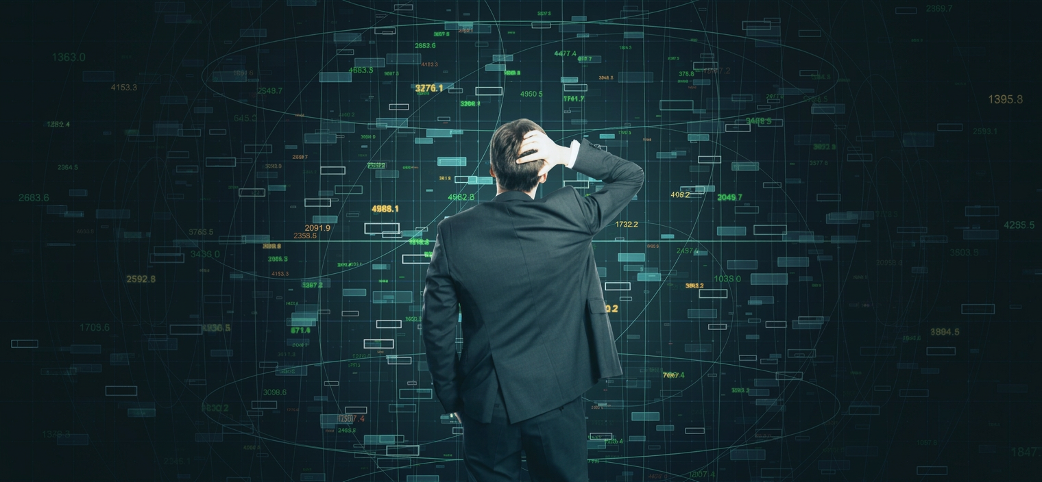 A man facing a wall of data, illustrating information overload.